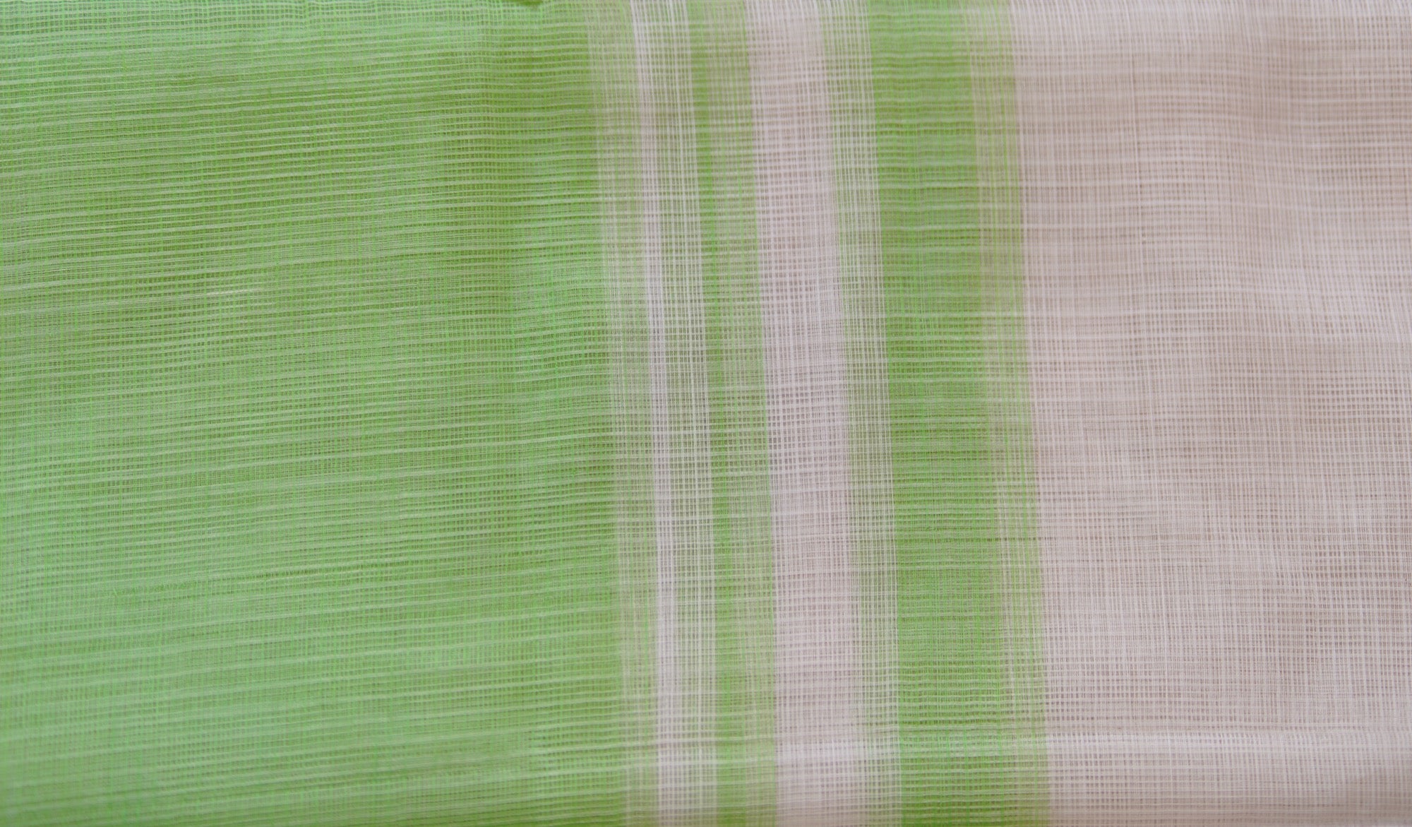 Close-up of khat-patterned texture of pastel-green Kota Doria handloom cotton saree