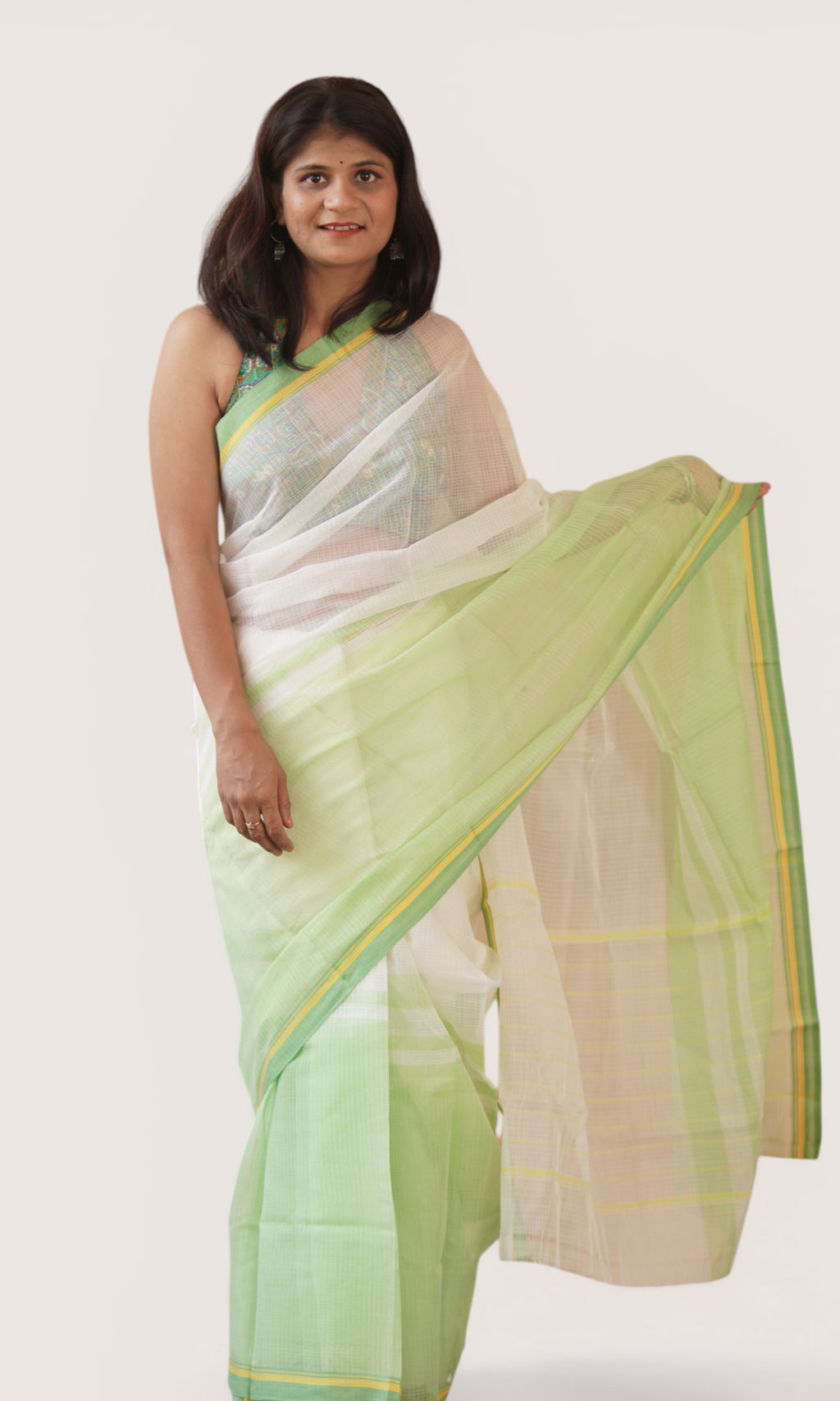 Left view of off-white Kota Doria handloom saree with pastel green yellow border