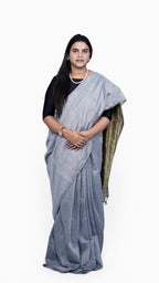 front full view of model wearing ash grey khadi cotton handloom saree from West Bengal