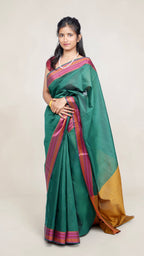 model draped in bottle green banaras cotton silk saree