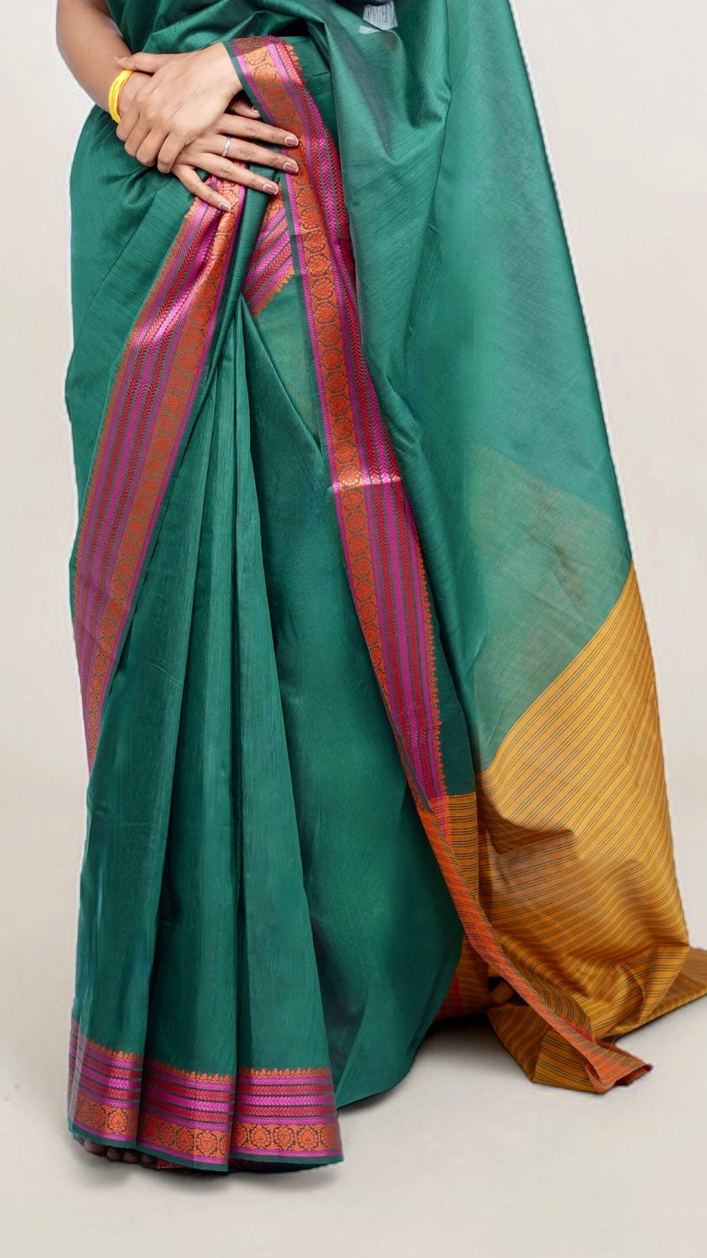 peats close-up of model draped in bottle green Banaras cotton-silk saree