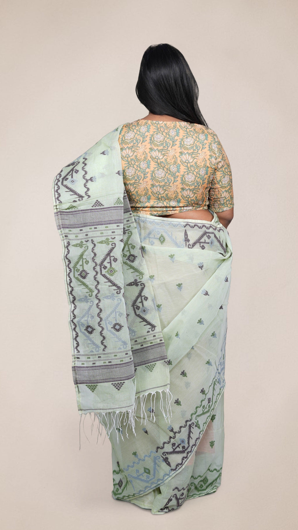 pallu details a mint green Baluchari Taant cotton saree with jacquard-woven motifs from West Bengal
