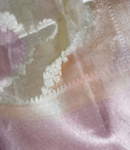 fabric texture of pastel peach tissue rangkat banarasi handloom saree.