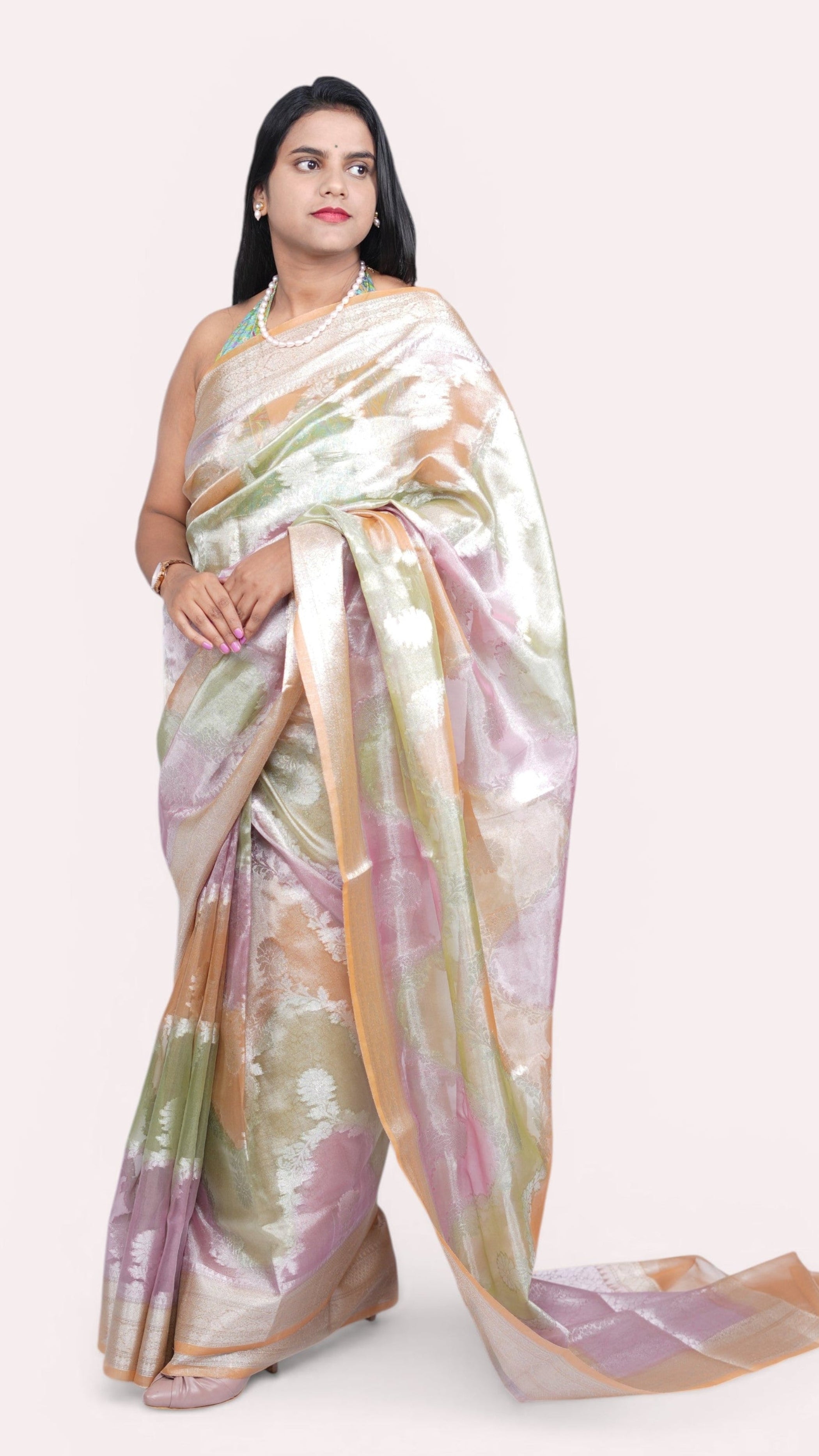 right view of model draped in pastel peach tissue rangkat banarasi handloom saree