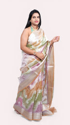 Left view of model draped in pastel peach tissue rangkat banarasi saree.