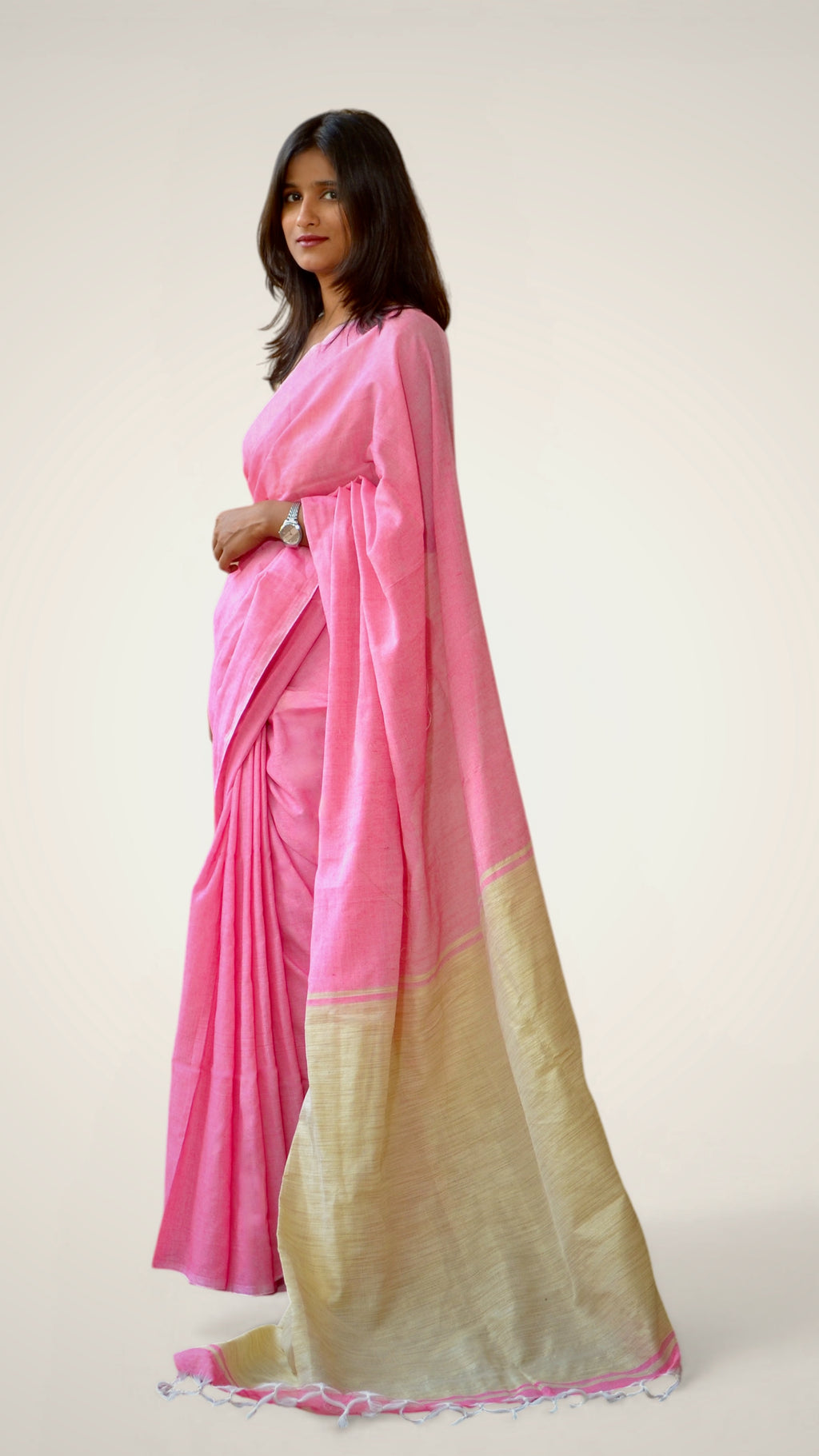 Handwoven pink khadi cotton saree with traditional pallu. 
