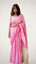 a pink khadi cotton saree showcasing soft drape and breathable handloom fabric.