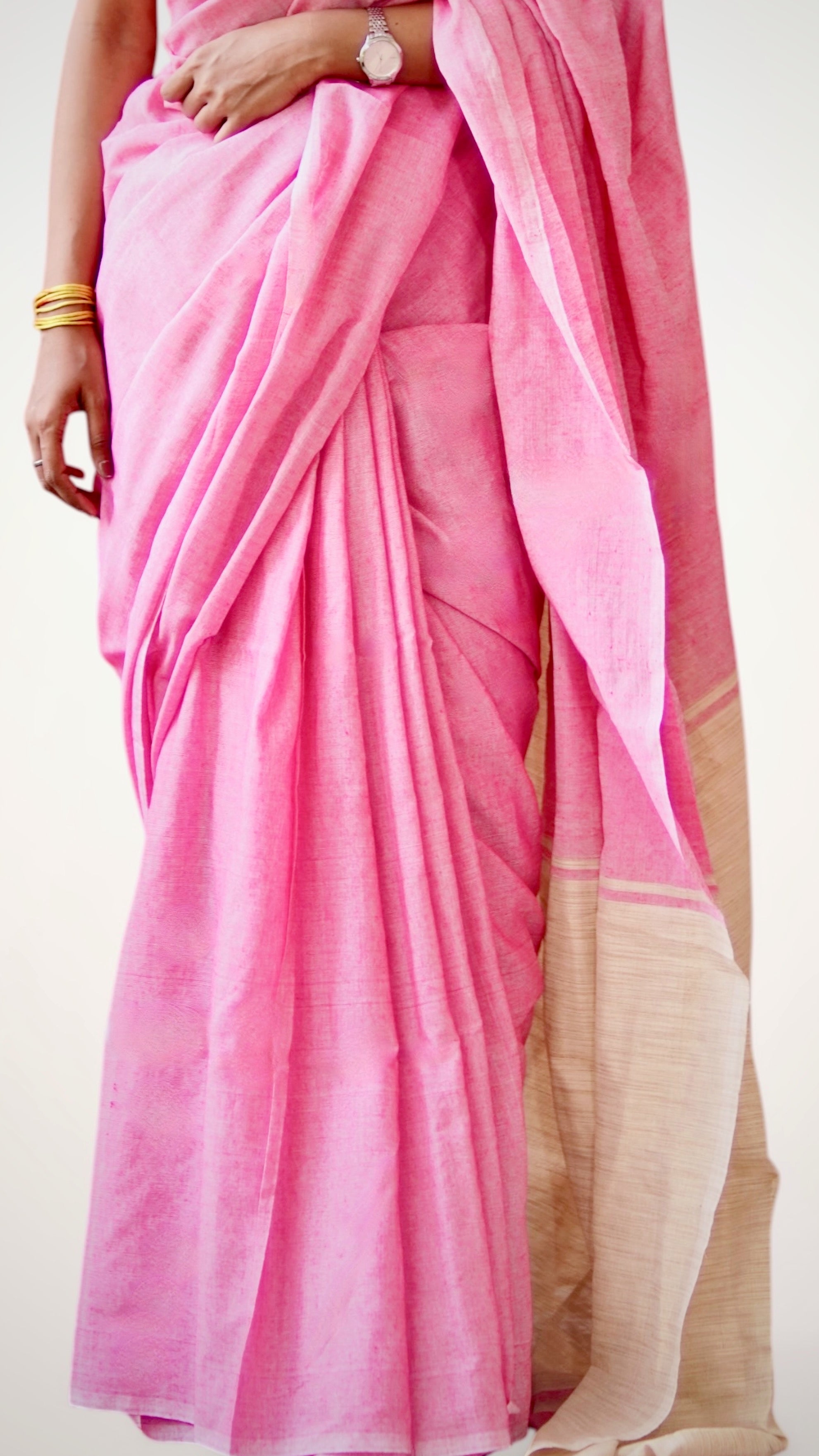 Pleats of handwoven pink khadi cotton saree