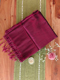 Close-up texture of magenta West Bengal tissue cotton handloom saree.