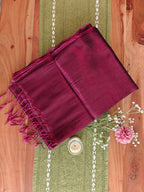 Close-up texture of magenta West Bengal tissue cotton handloom saree.